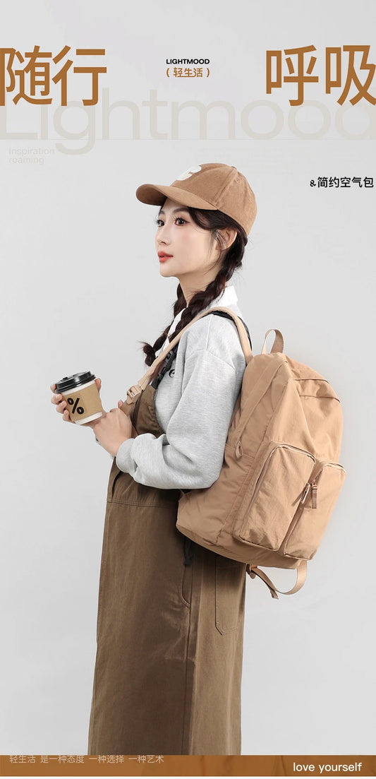 Water - resistant double - shoulder backpack. It has a large capacity, is lightweight and casual. Made of wrinkled and washed ny