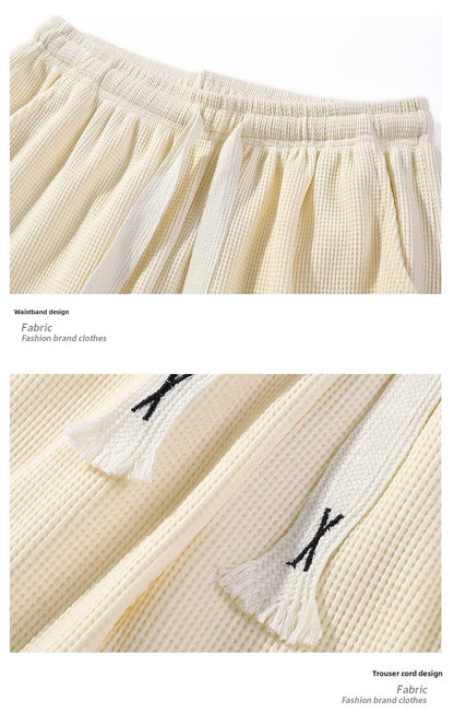 Sports shorts for men in summer  thin ice silk quick drying five quarter pants  fashionable waffle style drawstring shorts