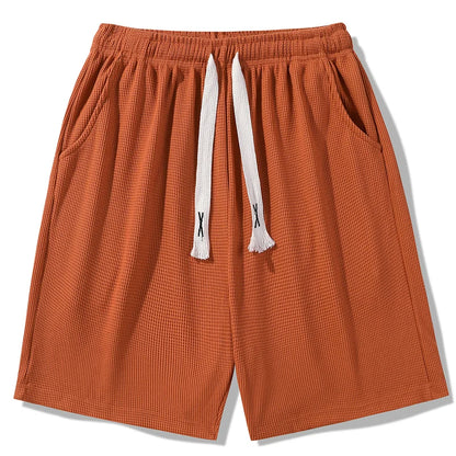 Sports shorts for men in summer  thin ice silk quick drying five quarter pants  fashionable waffle style drawstring shorts